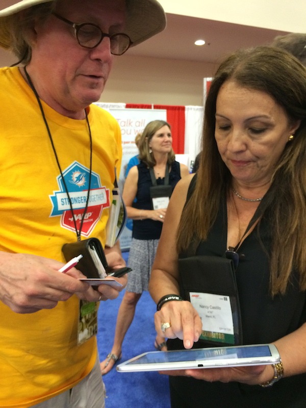 Signing Up for Discount at the Life At 50+ National Event with David from Gypsynester